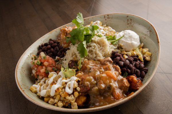 A bowl of food on a table.