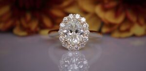 a close up of a diamond ring on a table