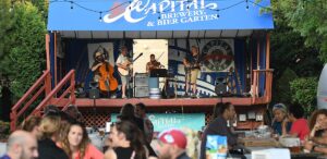 a group of people standing on top of a stage