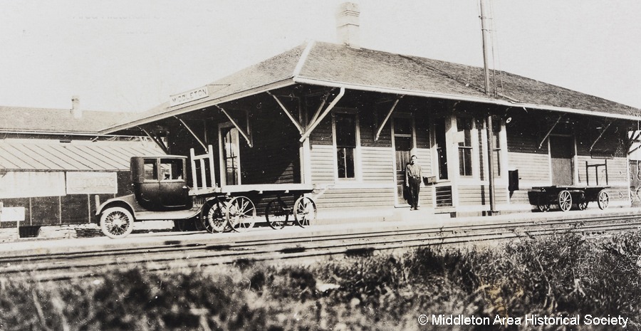a black and white photo of a train station