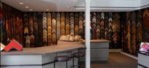 a bar with stools and a wallpapered wall behind it