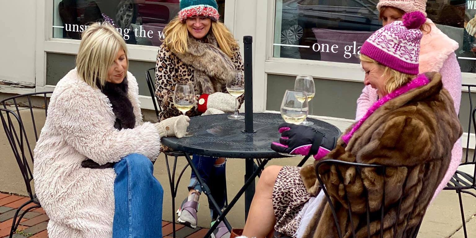 a group of women sitting around a table