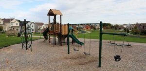 a playground with swings and a swing set
