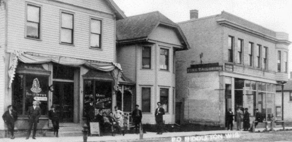a group of people standing outside of a building
