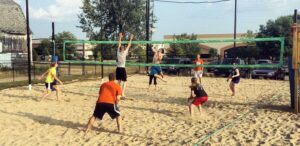 a group of people playing a game of volleyball