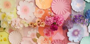 a bunch of paper flowers on a wall