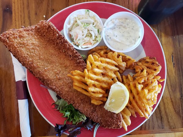 A plate with fish and fries on it from a Friday fish fry.
