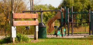 a children's play area with a slide and a playground