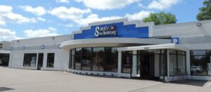 a building that has a car dealership in it