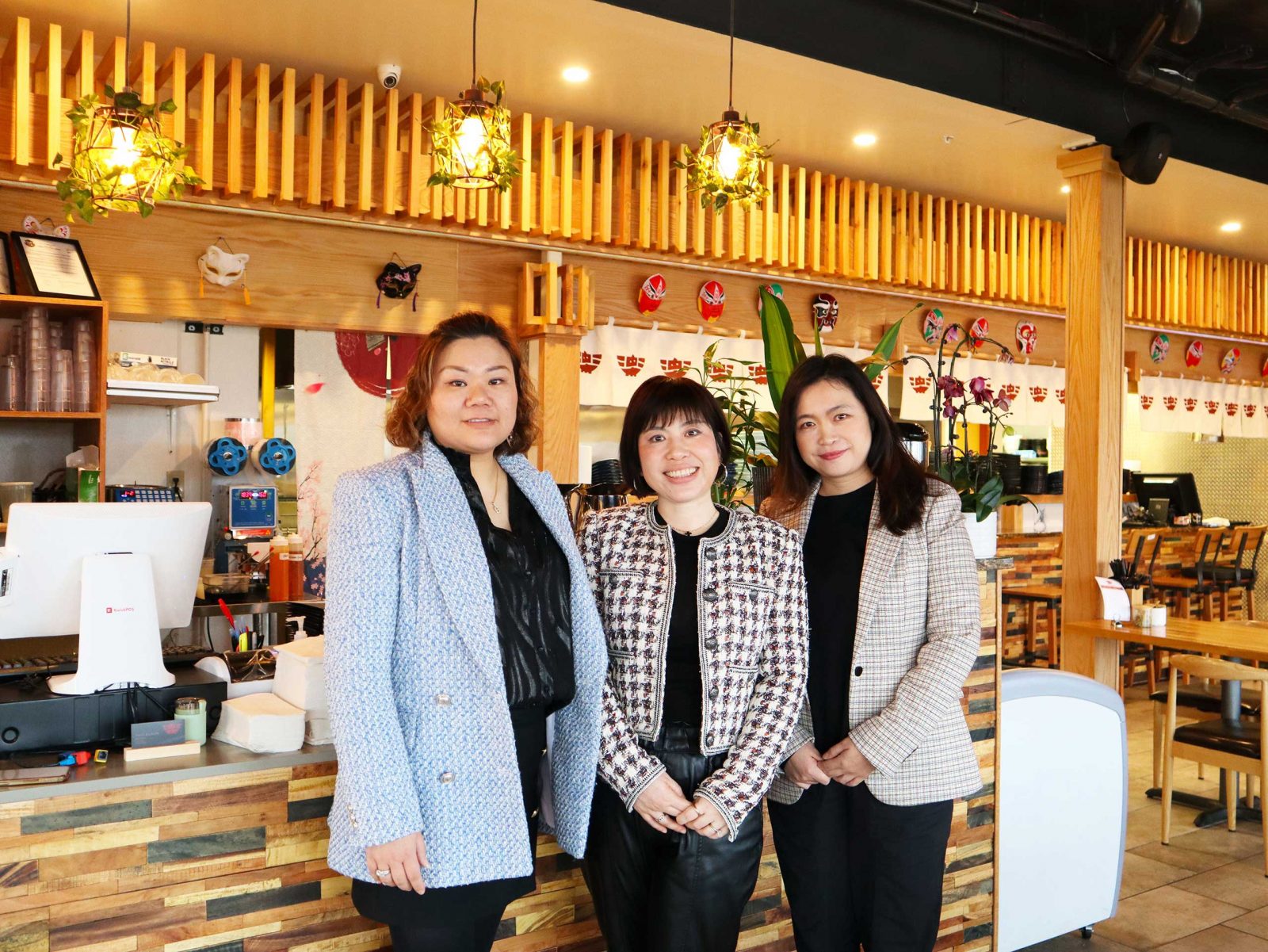 a group of women standing next to each other.