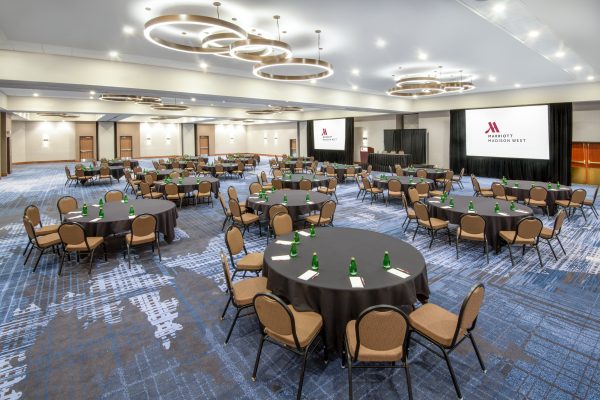 A large conference room with tables and chairs.